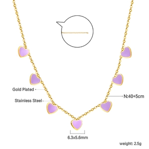 Detail view of 18K gold plated stainless steel necklace with purple heart pendants