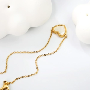 Bracelet cœur doré avec incrustation nacre blanche et bordure perlée pour femme