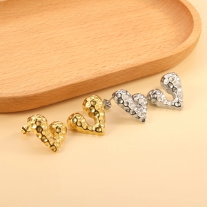 Irregular hammered heart stud earrings in gold and silver stainless steel finish