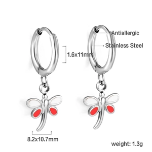 Detailed view of stainless steel dragonfly earrings with red enamel and size markings