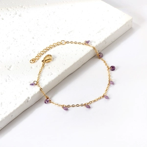 Elegant gold stainless steel chain bracelet with purple teardrop crystal and lobster clasp