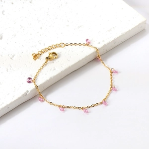 18k gold plated stainless steel bracelet with pink crystal charms on white stone
