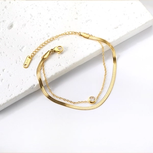 Double-layered 18K gold plated flat snake chain bracelet with sparkling white zircon stone