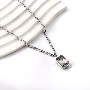 Detail of a vintage-style rectangular smoke grey gemstone necklace in stainless steel