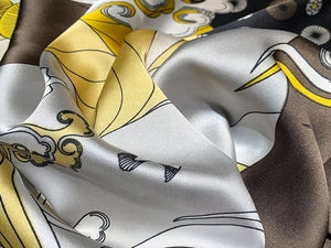 Detailed macro view showing the glossy satin silk texture and Japanese floral print