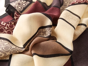 Detailed close-up showing the premium woven texture and geometric blocks of the large scarf