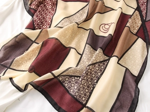 Detail of vintage geometric paisley pattern on lightweight cotton linen square scarf