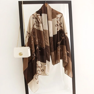 Detailed close-up of retro geometric pattern and chain print on a cotton-linen feel scarf