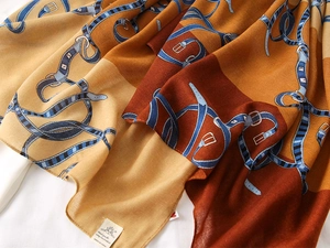 Detailed texture of color-blocked vintage belt pattern scarf with soft cotton-linen feel