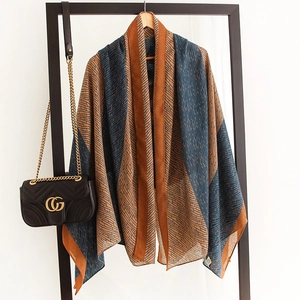 Detail of cotton-linen feel large scarf featuring geometric brick pattern and bi-color design
