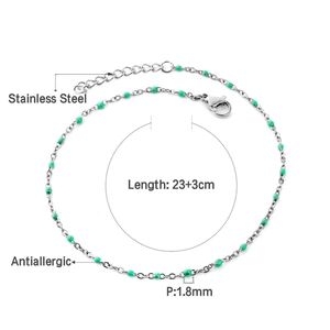 Detail of stainless steel anklet with green beads showing 23+3cm length and antiallergic tag