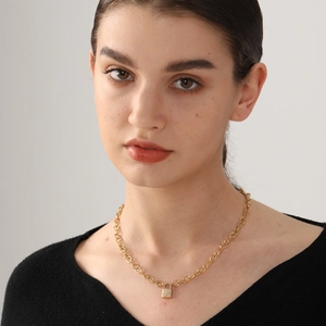 Golden padlock pendant necklace with sparkling micro-pave crystals on a circular link chain