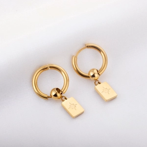 Gold stainless steel hoop earrings with engraved star rectangular charms on silk