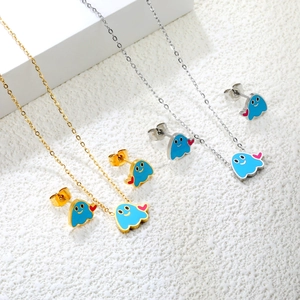 Ghost jewelry set with blue enamel pendant and red heart on a gold and silver chain