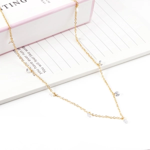 Elegant gold stainless steel necklace with clear crystal charms on minimalist chain