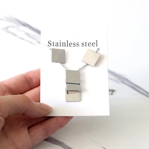 Minimalist silver stainless steel jewelry set featuring stacked square geometric pendants