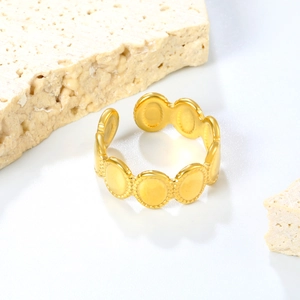 Elegant 18K gold plated oval disc open ring with beaded edges on a minimalist stone base