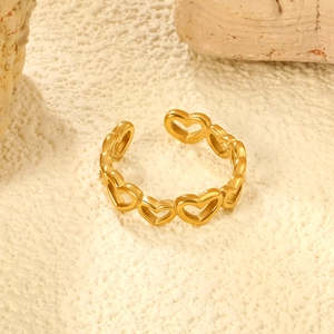 Detailed view of hollow heart-shaped open ring in polished 18K gold-plated finish