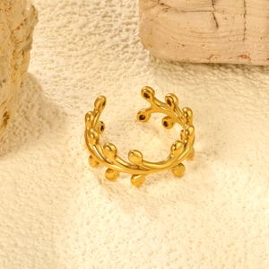 Irregular 18K gold stainless steel open ring with organic bead design on a stone surface