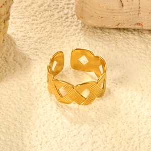 Detail of 18K gold stainless steel open ring with woven texture and hollow rhombus patterns