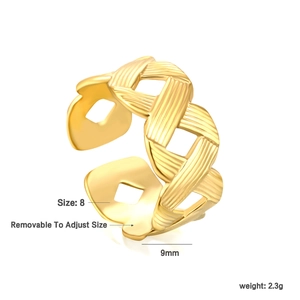 Macro detail of 18K gold plated woven texture ring showing 9mm width and open design