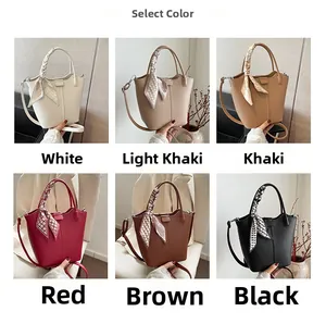 Selection of large bucket bags in six colors with decorative silk scarves and shoulder straps