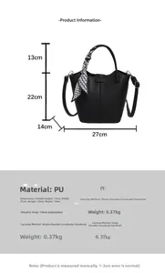 Detail showing dimensions of large black bucket bag with lychee texture and silk scarf