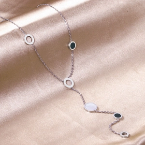 Minimalist silver Y-shaped tassel necklace with shell and black enamel round pendants