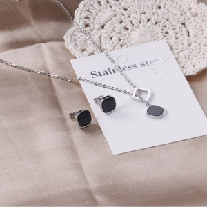 Elegant stainless steel jewelry set with geometric black enamel square pendant and studs