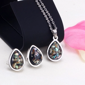 Detail of waterdrop jewelry set featuring black stone with iridescent shell inlays