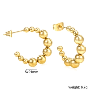 Macro view of gold-plated 18K stainless steel C-shaped earrings with gradient beads