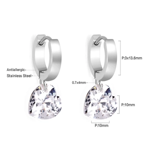 Detailed view of silver stainless steel hoop earrings with sparkling heart zircon pendants