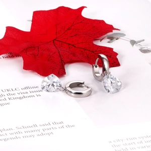 Elegant silver heart earrings with sparkling cubic zirconia on a minimalist hoop design
