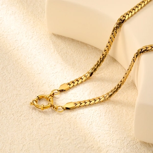 Macro shot of 18K gold plated flat snake chain with high-shine finish and spring clasp