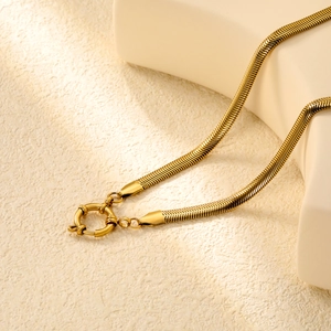 Detail of 18K gold plated herringbone snake chain featuring a round spring clasp closure