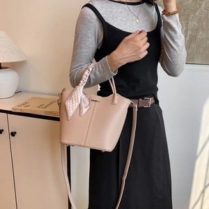 Large capacity apricot bucket bag with lychee texture and silk scarf handle detail