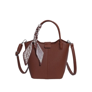 Brown lychee texture bucket bag with silk scarf handle and adjustable strap