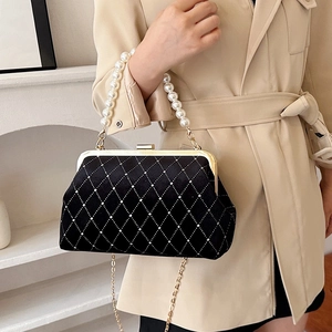 Quilted black velvet handbag with pearl handle and rhinestone pattern for evening events