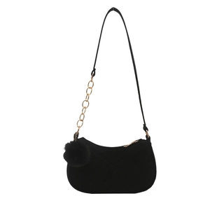 Black velvet underarm bag with V-quilting, gold chain strap and fur ball charm
