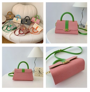 Nahaufnahme der Kontrastfarbe Box Tasche mit rosa Textilstoff und grünem Lederriemen