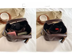 Detail view of the interior capacity and storage space of the dark brown leather tote bag