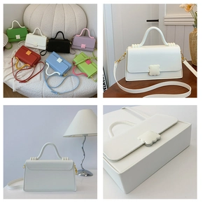 Detail view of the structured faux leather handbag with a unique cloud-shaped lock buckle