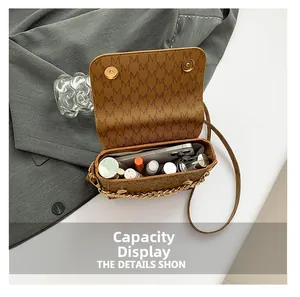 Detailed interior of the brown monogram small square bag showing large storage capacity