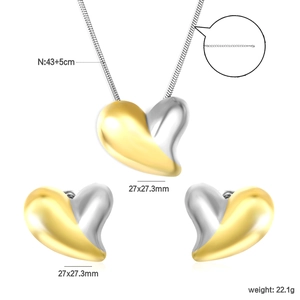 Detailed view of two-tone heart necklace and earrings set with size and weight specs