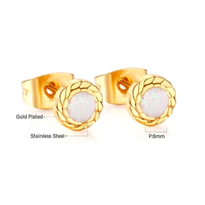 Detailed macro view of 6mm round gold-plated stainless steel studs with white glitter