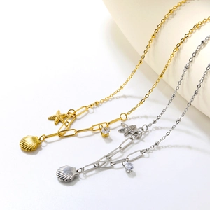 Collier pendentif étoile de mer et coquillage en or 18k et argent avec zircon