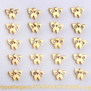 Macro detail of hypoallergenic golden 316 stainless steel butterfly earrings with crystals