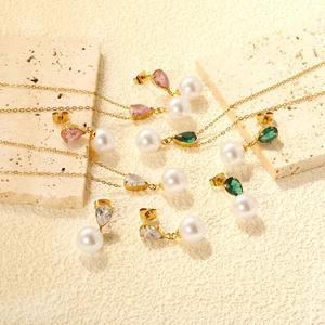 Teardrop gemstone necklace and pearl earring set in gold stainless steel finish