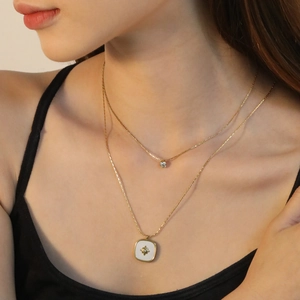 Double-layered 18K gold plated stainless steel necklace with white shell star pendant