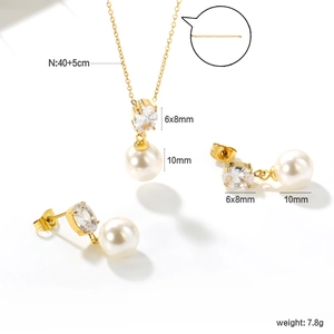 Detailed view of gold jewelry set showing necklace length and pearl size specifications